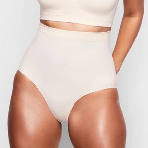 SKIMS Seamless Sculpt Mid Waist Core Control Brief Shape Wear In Sand Nude